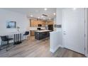 Bright, modern kitchen with an island, stainless appliances, and stylish pendant lighting at 1897 Trailside Dr, Palm Harbor, FL 34683