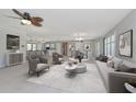 Open-concept living room with neutral colors and dining area at 1907 Sandpiper Dr, Clearwater, FL 33764