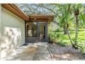 Close-up of screened entrance showcasing lush greenery at 2150 Shelly Dr # D, Palm Harbor, FL 34684
