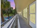 Well-maintained balcony featuring unit 26 with a view of the green space and nearby parking at 2416 World Parkway Blvd # 26, Clearwater, FL 33763