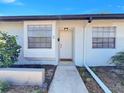 Inviting front entrance of a well-maintained townhome with a charming walkway and neat landscaping at 366 47Th N Ave # 3, St Petersburg, FL 33703