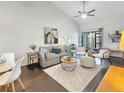 Bright living room featuring vaulted ceilings, stylish furnishings, and sliding doors to outdoor space at 366 47Th N Ave # 3, St Petersburg, FL 33703