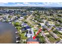 A neighborhood showcasing waterfront property with a modern home with solar panels at 3800 Shore Acres Ne Blvd, St Petersburg, FL 33703