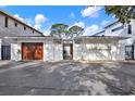 Contemporary home featuring a private courtyard entrance and a two-car garage at 3800 Shore Acres Ne Blvd, St Petersburg, FL 33703
