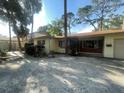 Home exterior with a brick facade and neat landscaping on a sunny day at 4711 W Vasconia St, Tampa, FL 33629