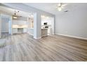 Bright living room featuring modern vinyl flooring and neutral paint at 5048 Sunridge Palms Dr # 103, Tampa, FL 33617