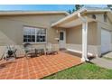 Welcoming front porch with outdoor seating and a brick-paved patio, perfect for relaxing at 5542 19Th N Ave, St Petersburg, FL 33710