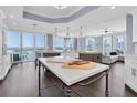 Chef's dream kitchen with marble countertops, large island, stainless steel appliances, and panoramic water views at 555 5Th Ne Ave # 1032, St Petersburg, FL 33701