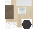 Interior design selections featuring light wood floors, dark cabinets and designer backsplash at 5717 Spivey Ct, Wesley Chapel, FL 33545