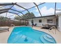 Inviting screened-in pool area, perfect for relaxing and entertaining outdoors at 6149 37Th N Ave, St Petersburg, FL 33710
