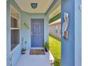 Inviting front porch with blue accents and a decorative pelican sculpture at 6232 Crickethollow Dr, Riverview, FL 33578
