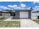 Lovely one-story home featuring a single-car garage, a gated front yard, and a neatly maintained exterior at 702 Regent S Cir, Brandon, FL 33511