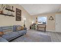 Cozy living room offering tile flooring, soft grey sectional sofa, and decor adding charm and style to the interior space at 8708 Albion Ct, Tampa, FL 33634