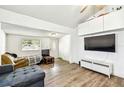 A living room with hardwood floors and a view of the front door and window at 1420 W Rambla St, Tampa, FL 33612