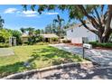Inviting home with a lush, green front yard and a long driveway leading to the property at 3626 S Hesperides St, Tampa, FL 33629