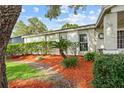 Charming home featuring a well-manicured lawn and colorful mulch landscaping at 4120 Tyndale Dr, Brandon, FL 33511