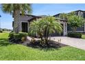 Beautiful single-Gathering home with manicured lawn, paver driveway, and lush landscaping at 4652 San Martino Dr, Wesley Chapel, FL 33543