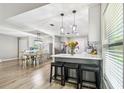Bright, modern kitchen with sleek white cabinets, stainless steel appliances, and bar seating at 509 Stone Dr, Brandon, FL 33510