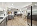 Bright open living space with modern kitchen, stainless appliances, and a vaulted ceiling at 509 Stone Dr, Brandon, FL 33510