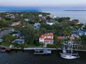 Beautiful waterfront home with lush landscaping and a private dock, offering stunning water views at 514 Riviera Dr, Tampa, FL 33606