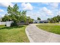 Well maintained driveway and landscaping complement this home at 6875 11Th N Ave, St Petersburg, FL 33710