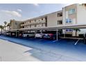 Covered parking area featuring multiple parking spaces available at the multi-story residential building at 7465 Bay Island S Dr # 213, South Pasadena, FL 33707