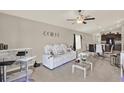 Bright living room boasts a modern bar area, comfortable seating, and neutral color palette at 1015 7Th Nw Ave, Ruskin, FL 33570