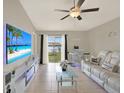 Relaxing living room with lake views and a cozy white couch, perfect for entertainment at 1015 7Th Nw Ave, Ruskin, FL 33570