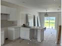 New kitchen build with white cabinets, marble countertops, and new appliances at 12223 Kirk Ave, Port Charlotte, FL 33981