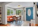 Cozy dining space filled with natural light and views of a lush outdoors at 1408 Michigan Ave, Palm Harbor, FL 34683