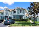 Charming two-story townhouse with manicured landscaping and a designated parking space visible at 1603 Fluorshire Dr, Brandon, FL 33511