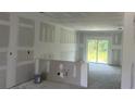Under construction interior showing framed walls, and roughed in plumbing in a home under construction at 17099 Carleen Ave, Port Charlotte, FL 33948
