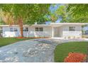 Charming single-story home with a well-manicured front yard and a welcoming front entrance at 2711 E 22Nd Ave, Tampa, FL 33605