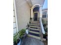 Inviting front porch with classic columns and stairs to the front door at 3710 N 57Th St, Tampa, FL 33619