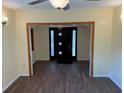 Entryway with wood look flooring, door with glass accents, and access to other rooms at 3762 18Th S Ter, St Petersburg, FL 33711