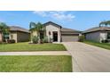 Charming single-story home features a well-manicured lawn and inviting curb appeal in a great neighborhood at 5043 White Chicory Dr, Apollo Beach, FL 33572