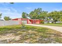 Charming home boasting a spacious front yard, attached garage and a white picket fence for added curb appeal at 603 Royal Crest Dr, Brandon, FL 33511