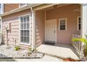 Exterior view of the home's front door and entrance at 9473 N Forest Hills Pl, Tampa, FL 33612