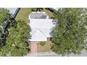 Overhead view of a well-maintained home with lush trees providing shade at 9690 41St N St # 0, Pinellas Park, FL 33782