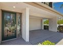 Charming home exterior with a beautiful stained-glass door, garage, and well-maintained landscaping at 101 Marina Del Rey Ct, Clearwater, FL 33767