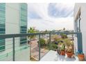Balcony view showing cruise ship and harbor with various potted plants at 101 N 12Th St # 400, Tampa, FL 33602