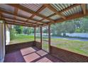 Inviting screened porch with a wooden floor and a view of the backyard at 1019 Lakeside Dr, Seffner, FL 33584