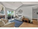 Comfortable living room with sliding doors leading to a balcony and vaulted ceilings at 10265 Gandy N Blvd # 906, St Petersburg, FL 33702