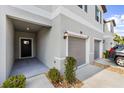 Townhouse exterior showing a one-car garage, rock landscaping, and a covered entrance at 10472 Shady Preserve Dr, Riverview, FL 33578