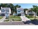 An elevated shot of a two-story home with a nice lawn, and a one-car garage at 10775 Glen Ellen Dr, Tampa, FL 33624