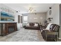 Comfortable living room showcasing a fireplace, plush seating, and a serene ambiance for relaxation and entertainment at 11029 Lynn Lake Cir, Tampa, FL 33625