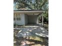 A covered carport featuring a concrete driveway at 12720 Jan St, San Antonio, FL 33576