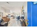 Open living room and kitchen area with plenty of natural light at 1304 Cedar Ct, Tarpon Springs, FL 34689