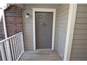 Inviting entrance featuring a solid neutral-colored door, brick accents, and secure keyed entry at 1400 Gandy N Blvd # 1705, St Petersburg, FL 33702