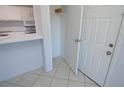 Bright, efficient kitchen with white cabinets, breakfast bar, and essential appliances at 1400 Gandy N Blvd # 1705, St Petersburg, FL 33702